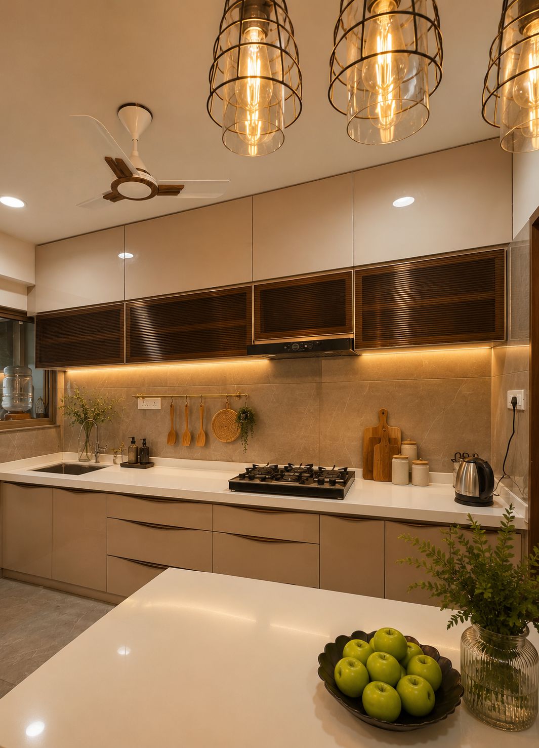 Full L-shaped kitchen with bar seating at Begwani's Residence