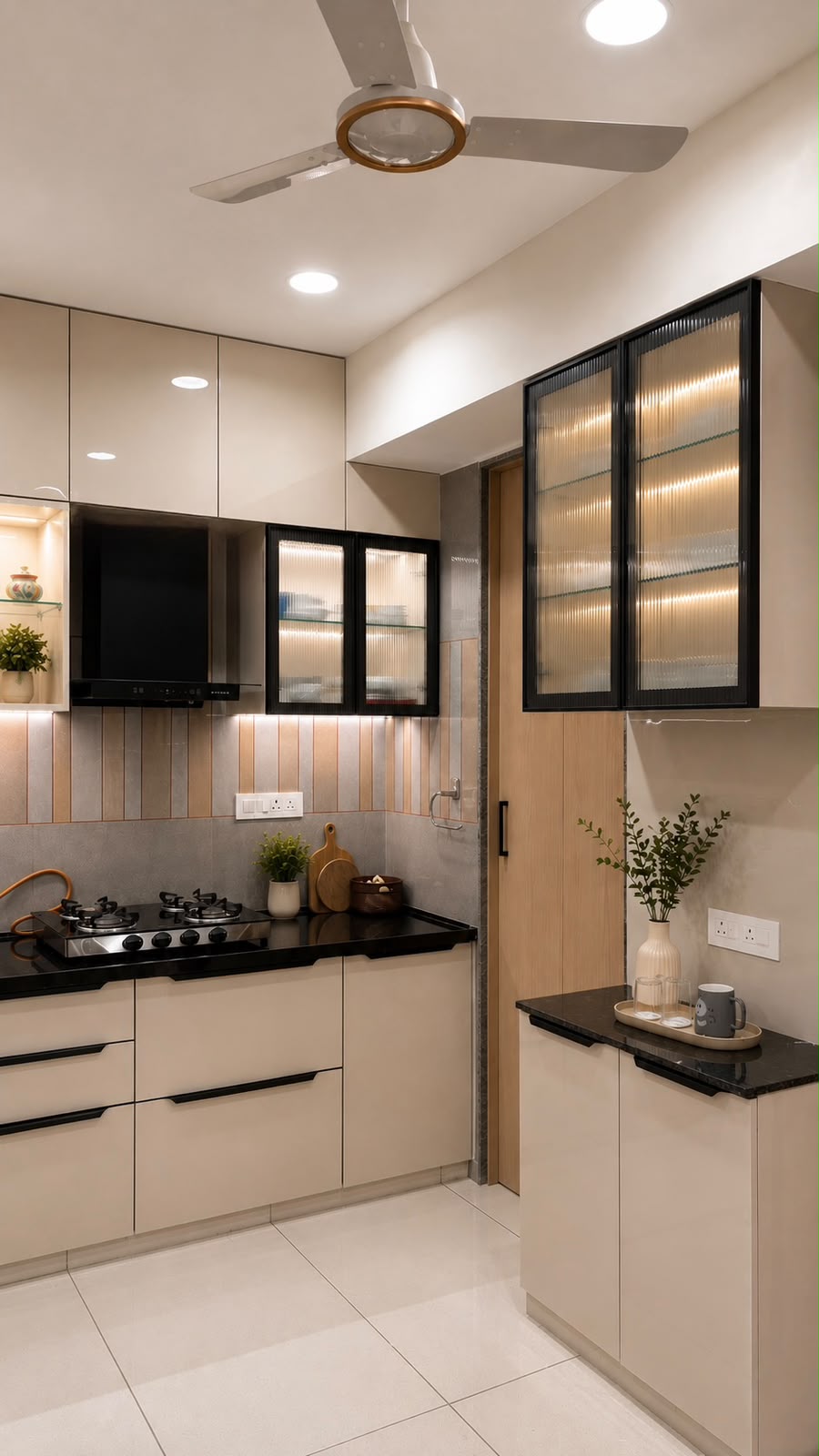 Kitchen with black glass partition at Sipani House
